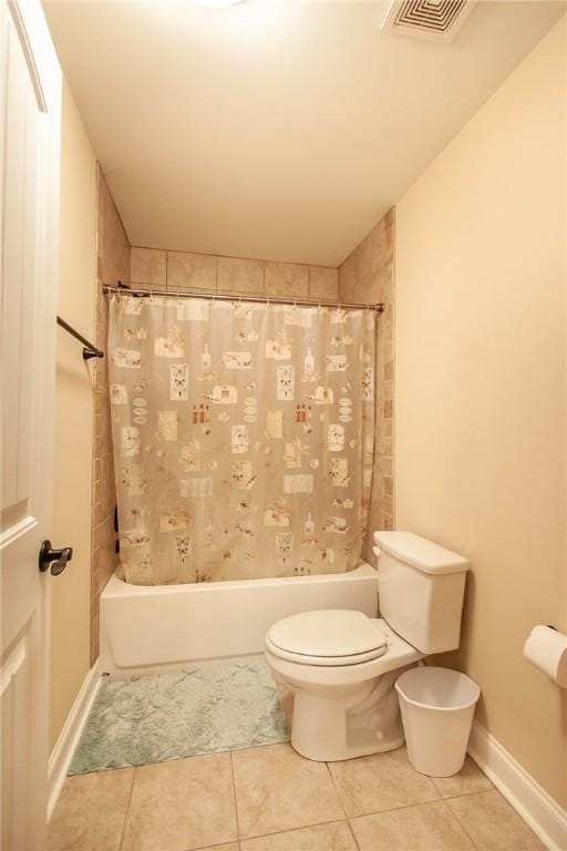 bathroom with tile patterned flooring and toilet