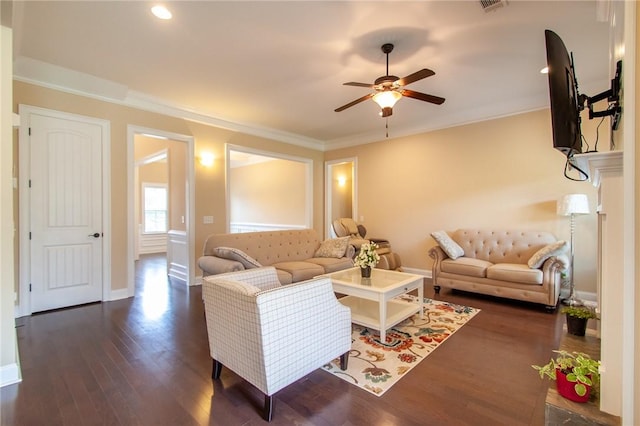 living room with ceiling fan, dark hardwood / wood-style flooring, and ornamental molding