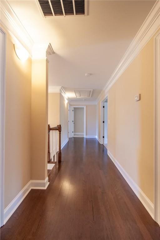 corridor with dark wood-type flooring and ornamental molding