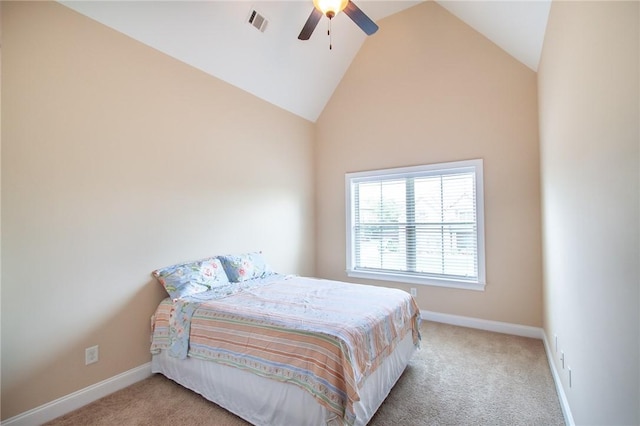 bedroom with light colored carpet, vaulted ceiling, and ceiling fan