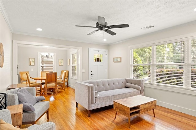 1016 E Magnolia Ave, Auburn, AL 36830 - living area featuring light wood-style flooring, a ceiling fan, ornamental molding, a chandelier, and recessed lighting