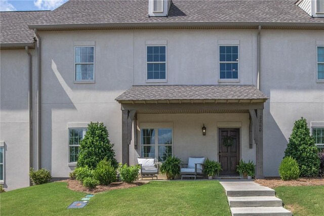 2260 Pam Cir, Auburn, AL 36832 - townhome / multi-family property with a front lawn, covered porch, and stucco siding