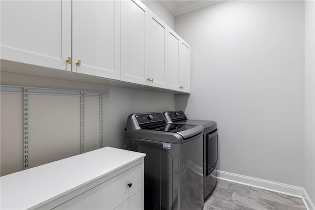 2260 Pam Cir, Auburn, AL 36832 - laundry area with cabinet space, independent washer and dryer, baseboards, and ornamental molding