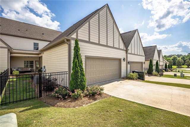 2260 Pam Cir, Auburn, AL 36832 - view of home's exterior with a garage, concrete driveway, and a shingled roof