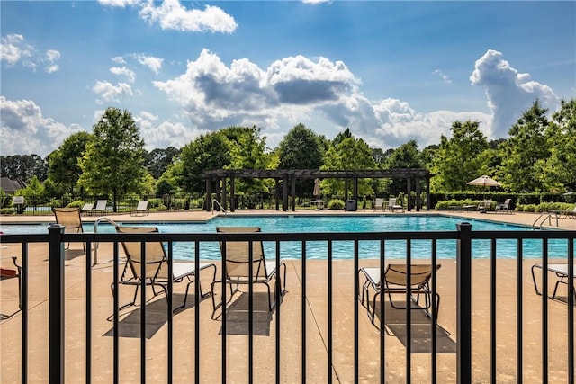 2260 Pam Cir, Auburn, AL 36832 - community pool featuring a pergola, a patio, and view of wooded area