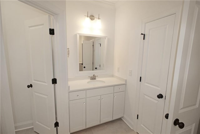 bathroom featuring tile patterned floors, vanity, and crown molding