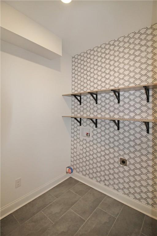 interior space featuring dark tile patterned flooring