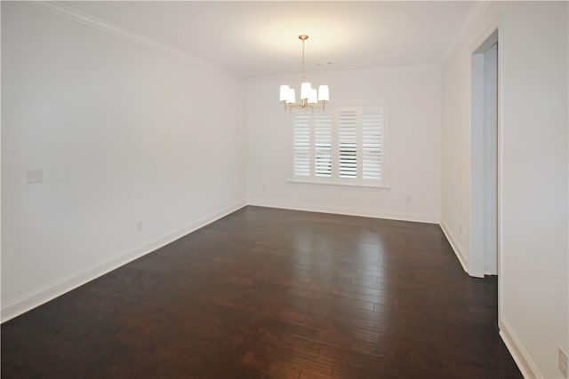 unfurnished room with a chandelier, crown molding, and dark hardwood / wood-style floors