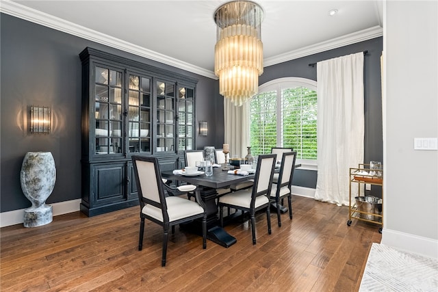 1569 Woodley Cir, Auburn, AL 36830 - dining area featuring a chandelier, baseboards, wood finished floors, and ornamental molding