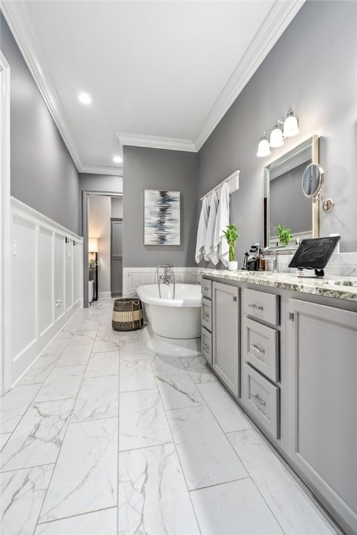 1569 Woodley Cir, Auburn, AL 36830 - full bath featuring ornamental molding, a freestanding tub, marble finish floors, vanity, and recessed lighting