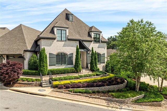 1569 Woodley Cir, Auburn, AL 36830 - french country inspired facade featuring brick siding and a shingled roof