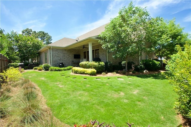 view of yard featuring ceiling fan