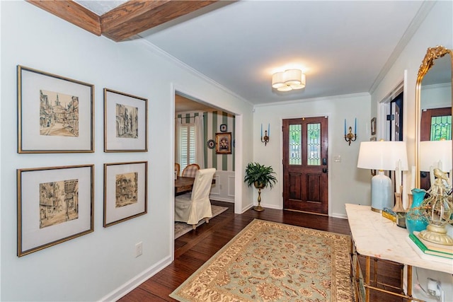 entrance foyer with dark hardwood / wood-style floors and ornamental molding