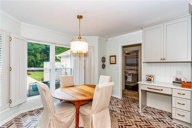 dining room with an inviting chandelier, a wealth of natural light, and ornamental molding