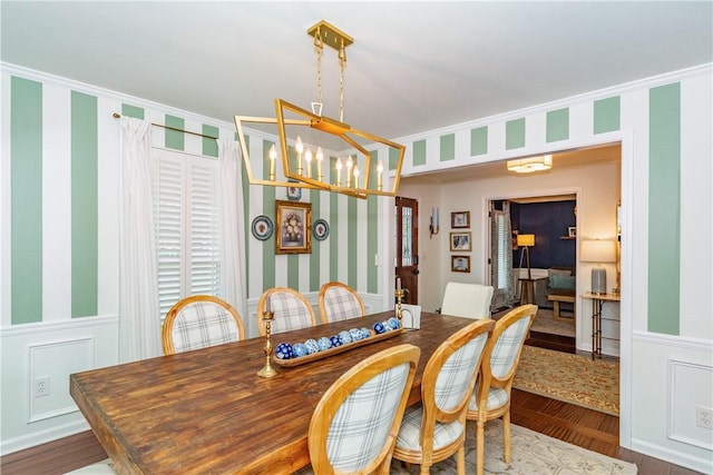 dining room featuring a chandelier and dark hardwood / wood-style floors