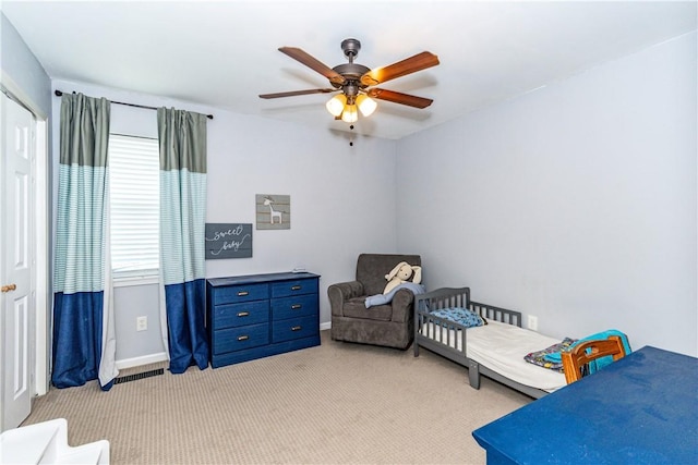 carpeted bedroom featuring ceiling fan