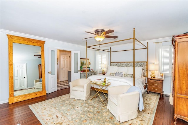 bedroom with ceiling fan, dark hardwood / wood-style flooring, and crown molding