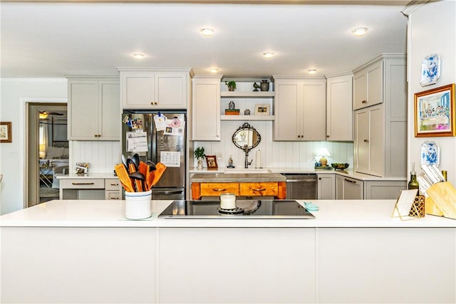 kitchen featuring decorative backsplash, appliances with stainless steel finishes, crown molding, and gray cabinetry