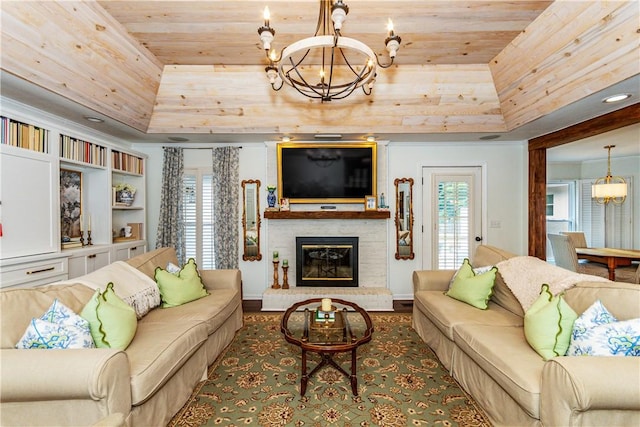 living room with an inviting chandelier, a raised ceiling, and wood ceiling