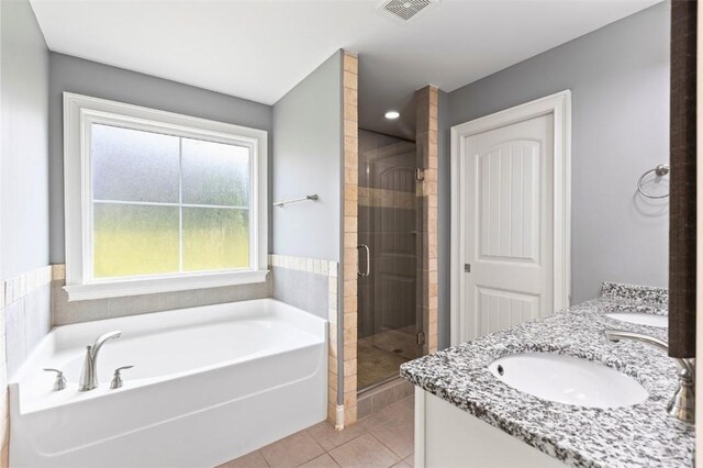 2375 Snowshill Ln, Auburn, AL 36832 - full bath featuring double vanity, a bath, a stall shower, and tile patterned flooring