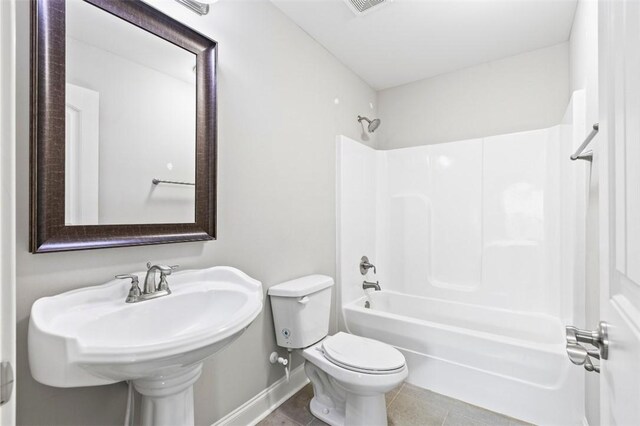 2375 Snowshill Ln, Auburn, AL 36832 - full bath featuring toilet, bathing tub / shower combination, baseboards, and tile patterned floors