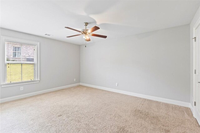 2375 Snowshill Ln, Auburn, AL 36832 - spare room featuring a ceiling fan, baseboards, and carpet