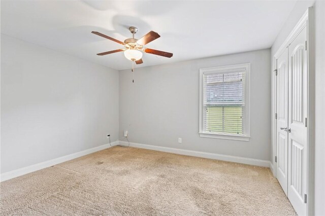 2375 Snowshill Ln, Auburn, AL 36832 - empty room with light colored carpet, ceiling fan, and baseboards