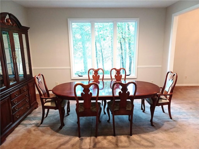 dining room with light colored carpet