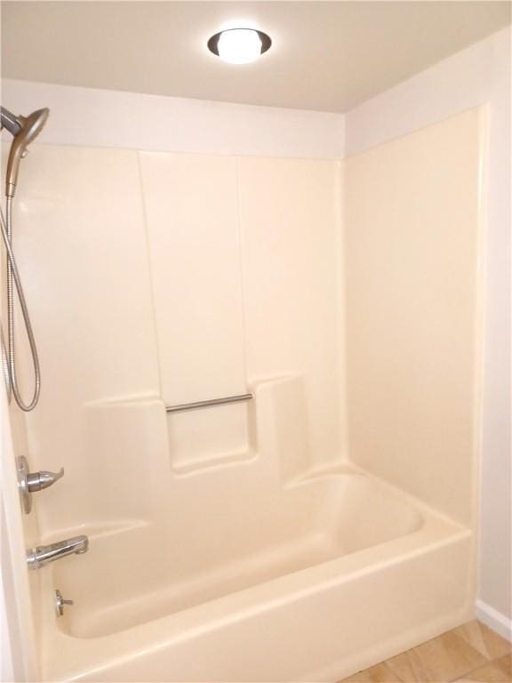 bathroom featuring tile patterned floors and shower / washtub combination