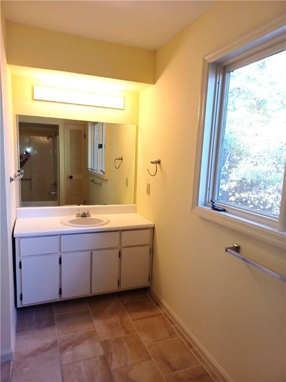 bathroom featuring plenty of natural light and vanity