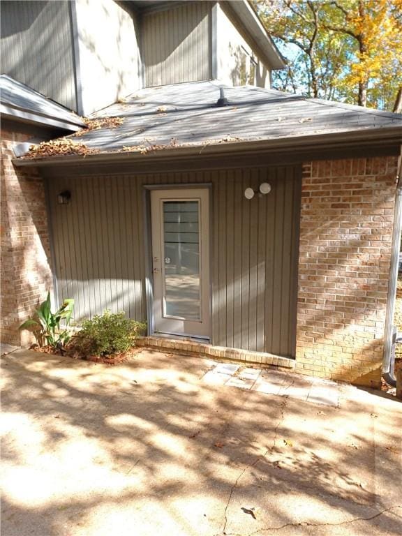 property entrance with a patio area