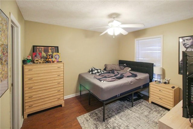 1477 N Donahue Dr Unit 3905, Auburn, AL 36830 - bedroom featuring wood finished floors, a ceiling fan, and baseboards