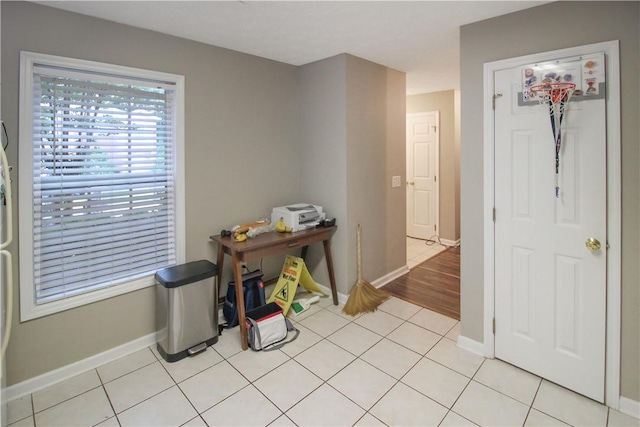 1477 N Donahue Dr Unit 3905, Auburn, AL 36830 - hallway featuring baseboards and light tile patterned floors