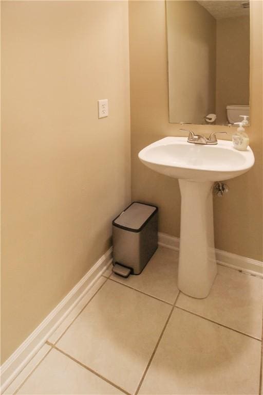 1477 N Donahue Dr Unit 3905, Auburn, AL 36830 - half bath with tile patterned floors and baseboards