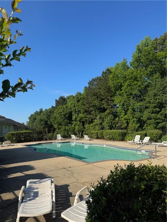 1477 N Donahue Dr Unit 3905, Auburn, AL 36830 - community pool featuring a patio area