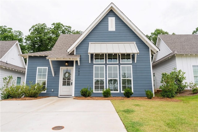 792 Village Dr, Opelika, AL 36801 - view of front of home with a front yard, roof with shingles, and a standing seam roof
