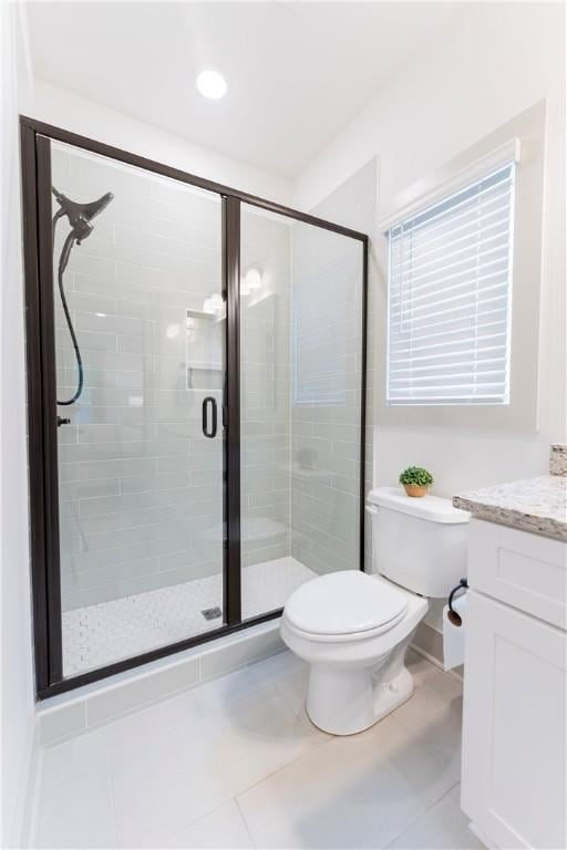 792 Village Dr, Opelika, AL 36801 - full bathroom featuring vanity, a stall shower, and tile patterned flooring