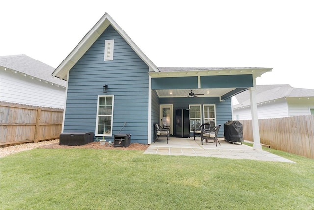 792 Village Dr, Opelika, AL 36801 - back of property featuring ceiling fan, a patio, and a fenced backyard