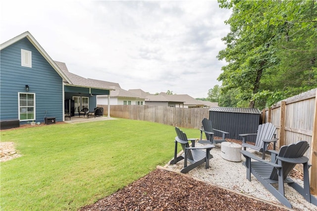 792 Village Dr, Opelika, AL 36801 - fenced backyard with an outdoor fire pit, a patio, and a storage shed