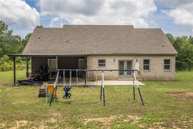 160 Indian Ln, Tallassee, AL 36078 - rear view of house featuring french doors, brick siding, a patio area, a shingled roof, and a yard