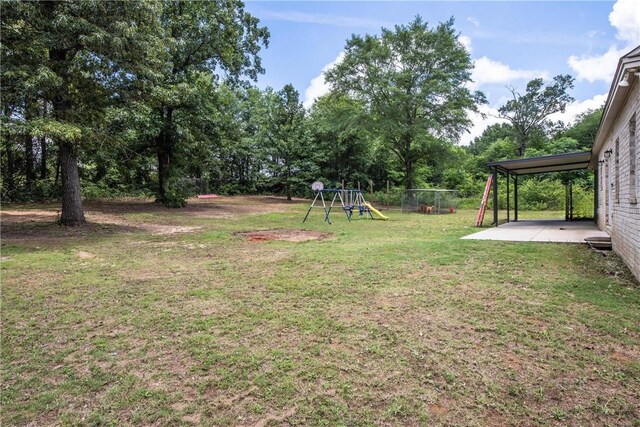 160 Indian Ln, Tallassee, AL 36078 - view of yard with a patio area and a playground