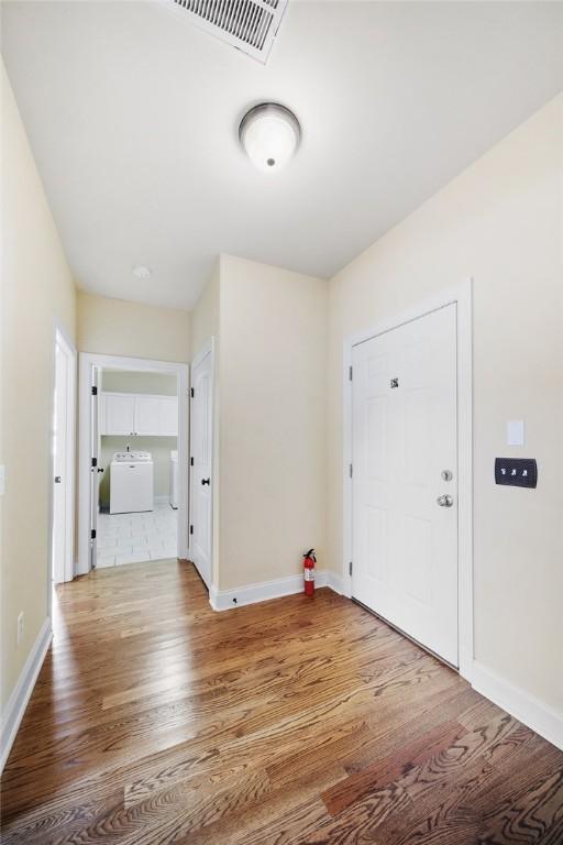 3204 Pinecrest Dr, Opelika, AL 36801 - foyer entrance with wood finished floors and washer / clothes dryer