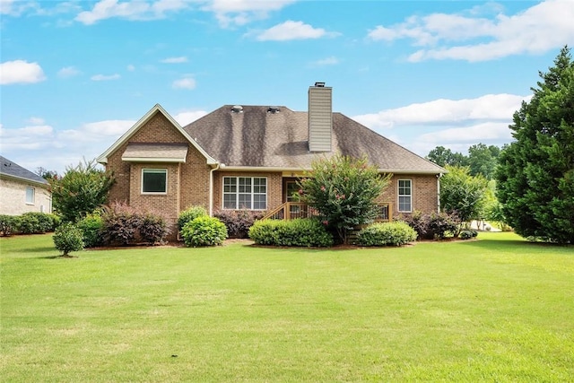 3204 Pinecrest Dr, Opelika, AL 36801 - rear view of property featuring a yard, brick siding, and a chimney