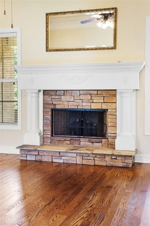 3204 Pinecrest Dr, Opelika, AL 36801 - detailed view of a fireplace, wood finished floors, and ceiling fan