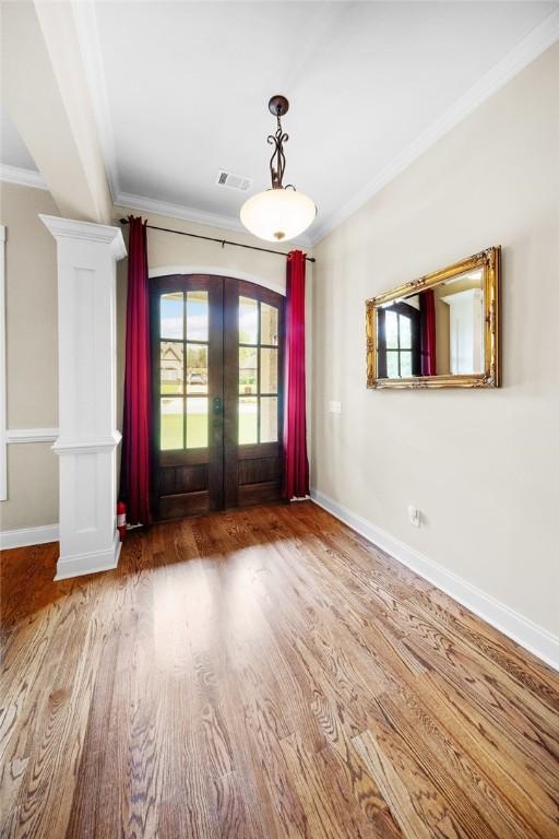 3204 Pinecrest Dr, Opelika, AL 36801 - entryway with french doors, crown molding, and wood finished floors