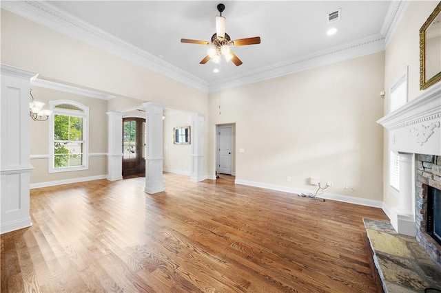 3204 Pinecrest Dr, Opelika, AL 36801 - unfurnished living room featuring decorative columns, a fireplace, a ceiling fan, light wood finished floors, and ornamental molding