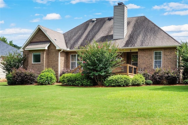3204 Pinecrest Dr, Opelika, AL 36801 - rear view of property with a lawn, brick siding, a chimney, and a shingled roof