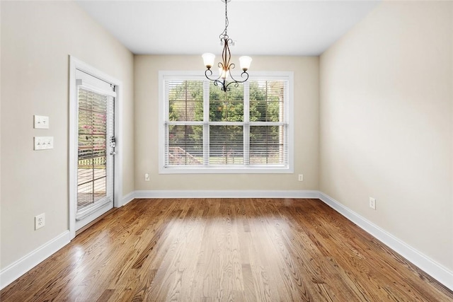 3204 Pinecrest Dr, Opelika, AL 36801 - unfurnished dining area featuring a chandelier and wood finished floors