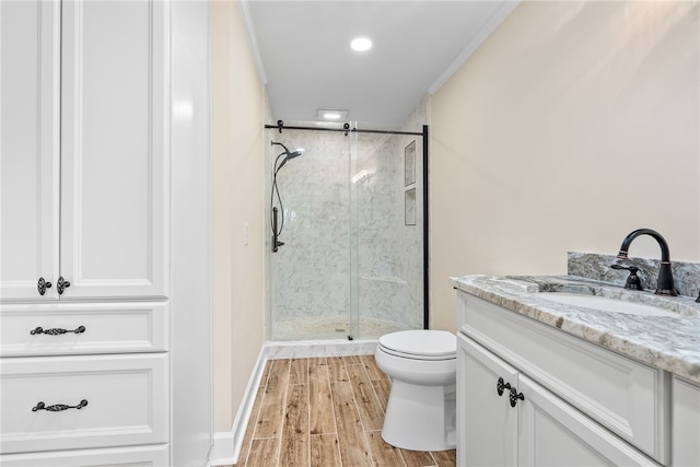 601 Overlook Dr, Opelika, AL 36801 - bathroom featuring toilet, wood finished floors, vanity, and a stall shower