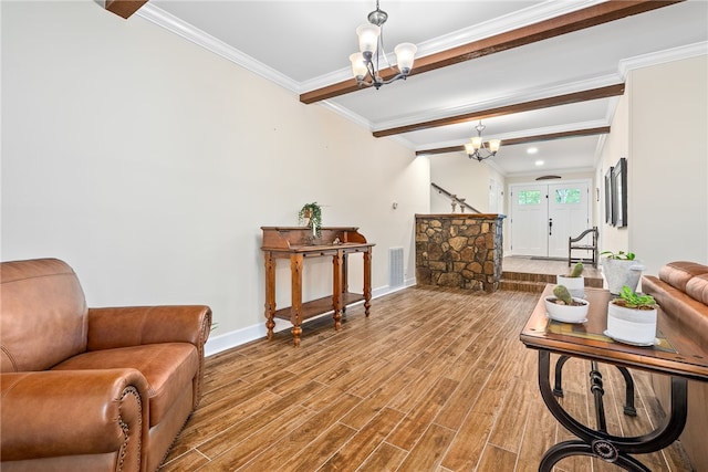 601 Overlook Dr, Opelika, AL 36801 - interior space featuring wood finished floors, visible vents, beamed ceiling, baseboards, and a notable chandelier